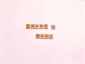 Scrabble tiles display 'Thank U Next' on a clean white background, perfect for creative projects.